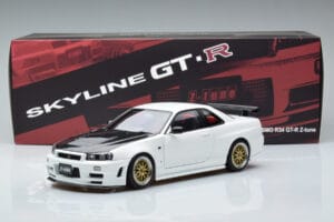 Nissan Skyline GT-R R34 Nismo Z-Tune Balts MotorHelix 1:18 M83407 Metāls — attēls 11 no 11