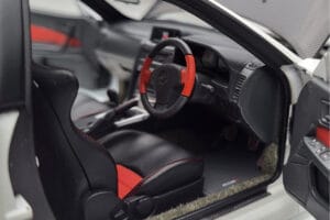 Nissan Skyline GT-R R34 Nismo Z-Tune Balts MotorHelix 1:18 M83407 Metāls — attēls 8 no 11