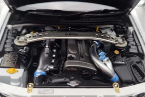 Nissan Skyline GT-R R34 Nismo Z-Tune Balts MotorHelix 1:18 M83407 Metāls — attēls 9 no 11