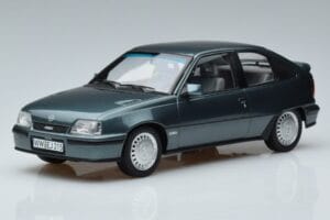 Opel Kadett E GSi Zils Metallik Norev 1:18 183614 Metāls