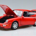 Porsche 911 964 Carrera 2 Sarkans Norev 1:18 187320 Metāls - image 2 of 7