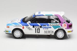 Mazda 323 GTX #10 T. Makinen / S. Harjanne 1000 Lakes Rally 1991 Otto 1:18 OT1099 Sveķi — attēls 3 no 6