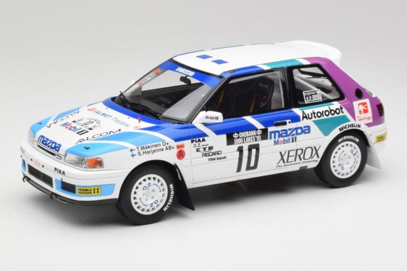 Mazda 323 GTX #10 T. Makinen / S. Harjanne 1000 Lakes Rally 1991 Otto 1:18 OT1099 Sveķi