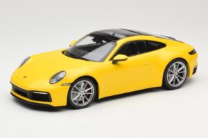 Porsche 911 992 Carrera 4S Dzeltens Minichamps 1:18 155067320 Metāls
