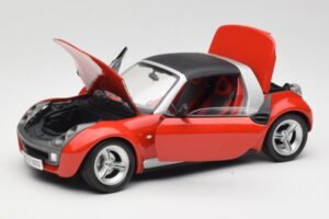 Smart Roadster Sarkans Bburago 1:18 34099 Metāls — attēls 2 no 8
